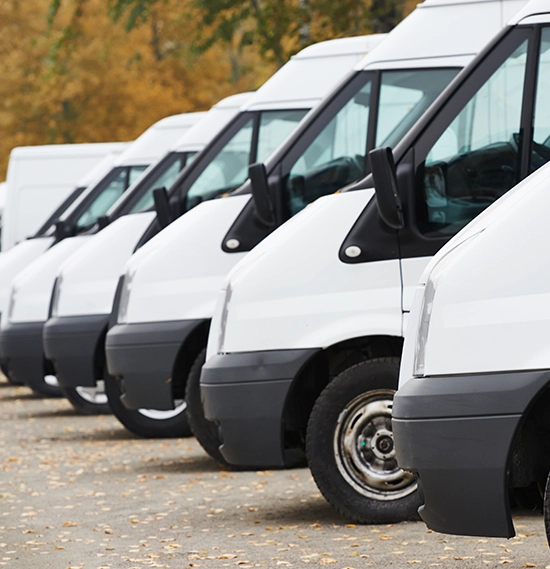 Commercial delivery vans in row at a parking space